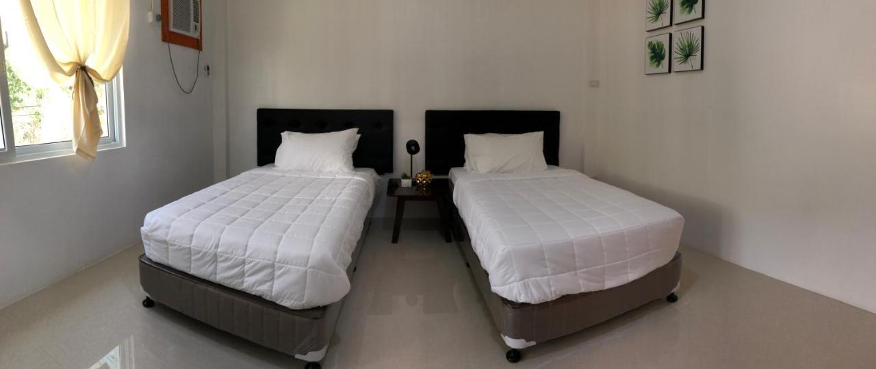 Arriyus Apartelle Daanbantayan Bagian luar foto